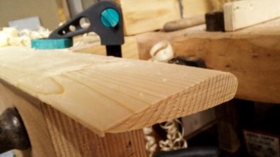 Work in progress photo of a wooden NACA airfoil made with a table saw and a planer out of spruce